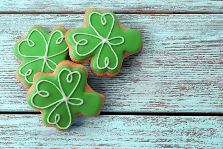 Decorative cookies on wooden background. Saint Patrics Day conceptの写真素材
