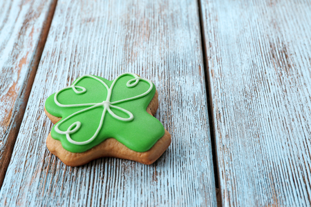 Decorative cookie on wooden background. Saint Patrics Day conceptの写真素材