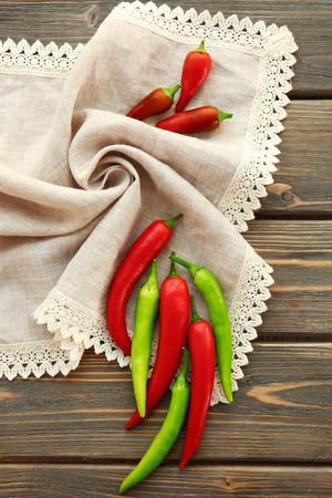 Fresh peppers on wooden tableの写真素材