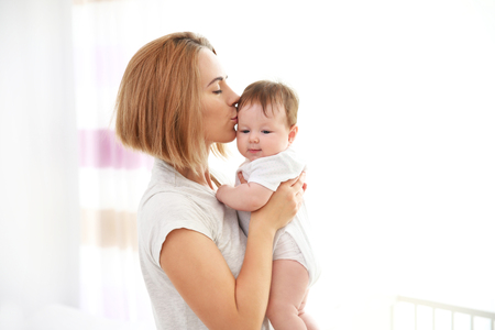 Mother with baby at homeの写真素材