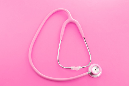 Pink stethoscope on pink backgroundの写真素材