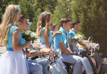 Bridesmaids and best men with scootersの写真素材