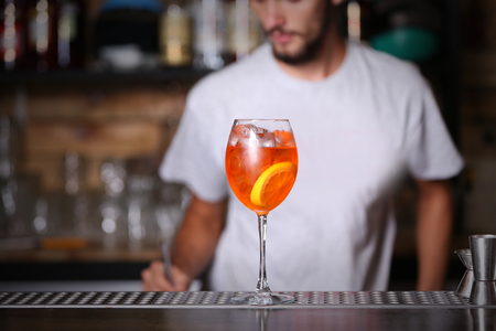 Barman preparing cocktail on bar counterの写真素材