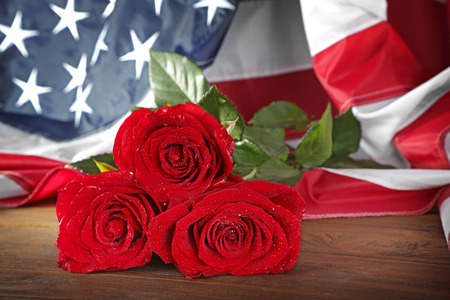 Red roses and American flag, closeupの写真素材