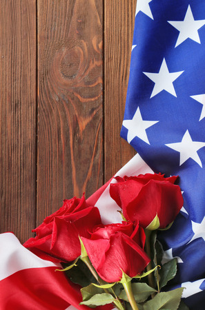 Red roses on American flag, closeupの写真素材