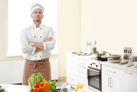 Young chef cook in kitchenの写真素材