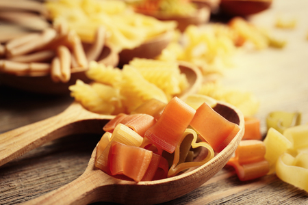 Pasta in wooden spoon, closeupの写真素材