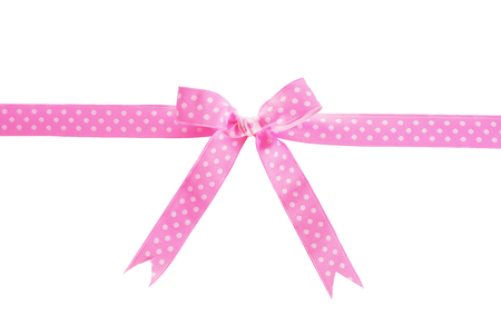 Silk ribbon with bow isolated on whiteの写真素材
