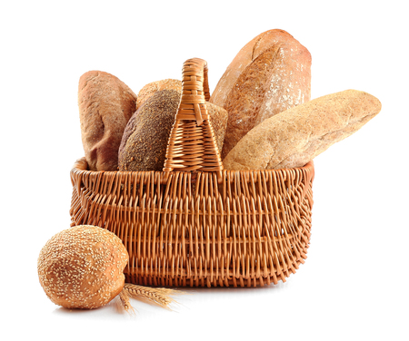 Fresh bread in wicker basket, isolated on whiteの写真素材