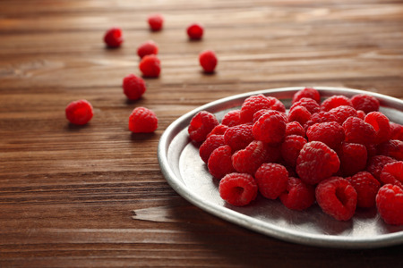 Fresh raspberries on plate, closeupの写真素材