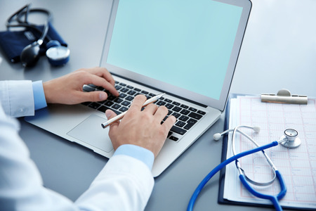 Male doctor at work in clinic office