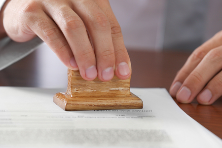 Notary public in office stamping documentの写真素材