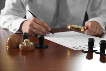 Stamps and ink pad on notary public table