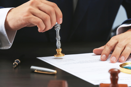 Notary public in office stamping document