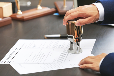 Notary public in office stamping document