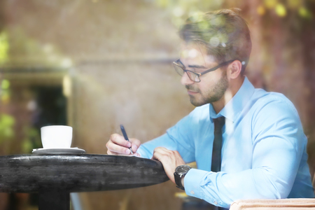 Handsome young lawyer  working in cafeの写真素材