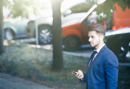 Lawyer  using smart phone on the streetの写真素材