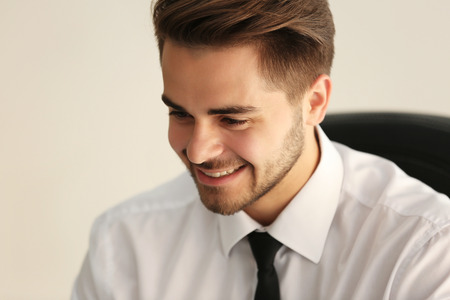Handsome young man working at office