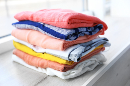 Pile of clothes on windowsill, closeupの写真素材