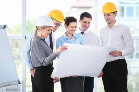 Group of young creative engineers discussing new project in officeの写真素材