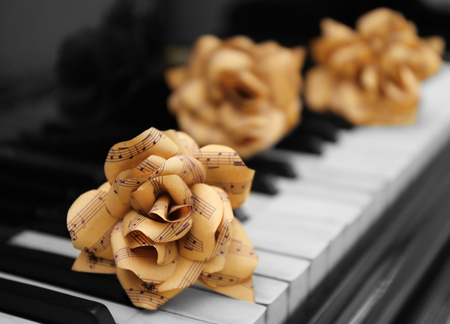 Rose made of music notes on piano keysの写真素材