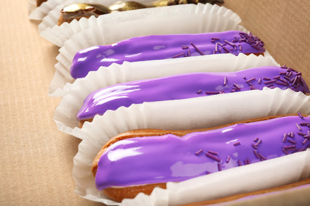 Delicious eclairs in cardboard box closeupの写真素材