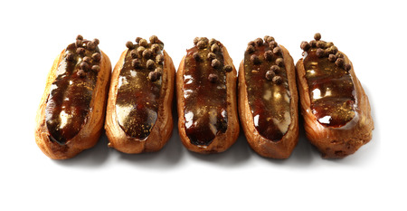 Delicious eclairs isolated on white