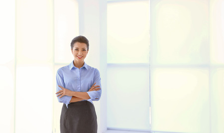 Beautiful businesswoman on light backgroundの写真素材