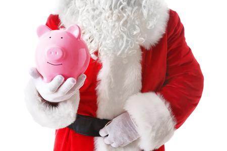 Santa Claus hand holding piggy bank on white backgroundの写真素材