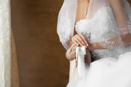 Hands of bride with ring on fingerの写真素材