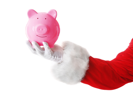 Santa Claus hand holding piggy bank on white backgroundの写真素材