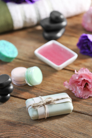 Body soap and spa treatments on wooden tableの写真素材