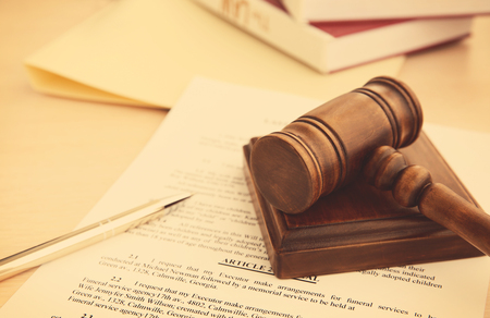 Court gavel and documents on tableの写真素材