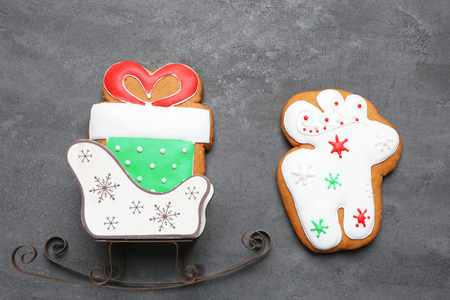Tasty gingerbread cookies on grey background, close up view