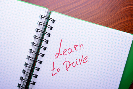 Notepad with text, close up. Learn to drive concept