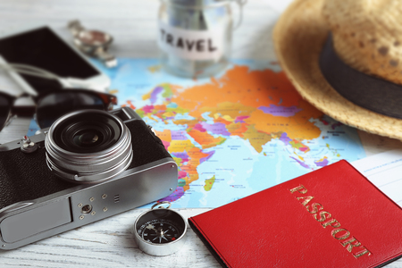 Traveller's accessories on world map background. Travel planning conceptの写真素材