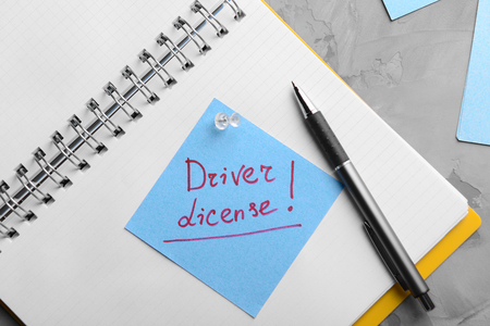 Notepad and note sticker with text. Driver license conceptの写真素材
