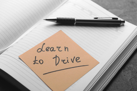 Notepad and note sticker with text. Learn to drive conceptの写真素材