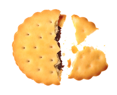 Tasty cookie with crumbs on white backgroundの写真素材