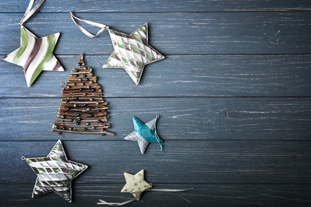 Handmade Christmas tree and some decor on wooden backgroundの写真素材