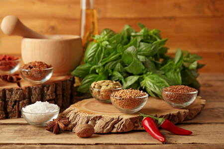 Composition with different spices on wooden backgroundの写真素材