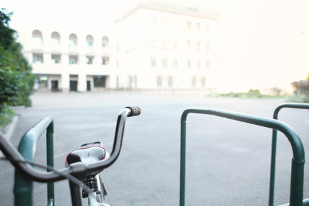 Close up view of bicycle parked outdoors, on blurred backgroundの写真素材