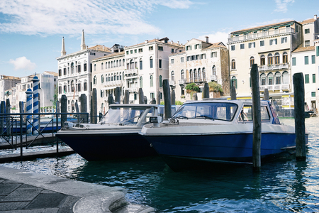 Boats moored near pierの写真素材