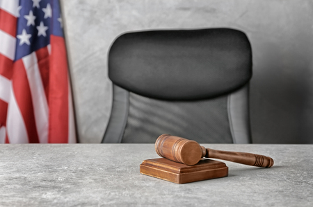 Judge gavel and soundboard on tableの写真素材