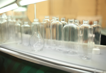 Stand with different containers for cosmetic products in retail shopの写真素材