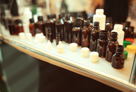 Stand with different containers for cosmetic products in retail shopの写真素材