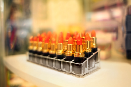Stand with lipsticks in cosmetic storeの写真素材
