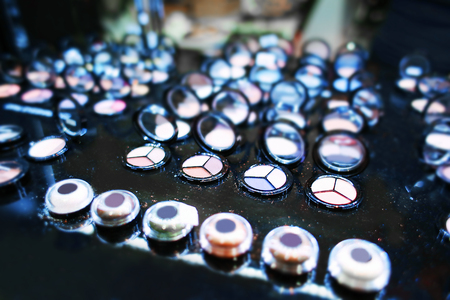 Assortment of different colourful eye shadow palettes in cosmetic storeの写真素材