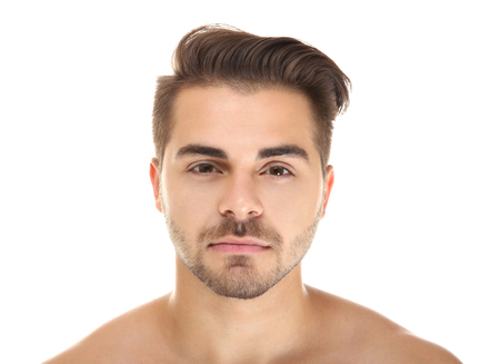 Portrait of young handsome man on white backgroundの写真素材