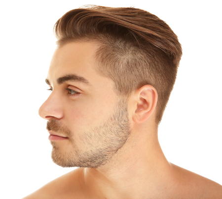 Portrait of young handsome man on white backgroundの写真素材